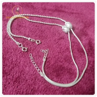 925 sterling adjustable silver payal with single oval carved silver ball with ball chain and plain chain on either sides.