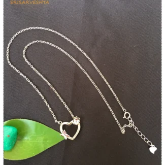 925 sterling silver chain with glittering stones on one side of wall with flower and butterfly on the wall too.